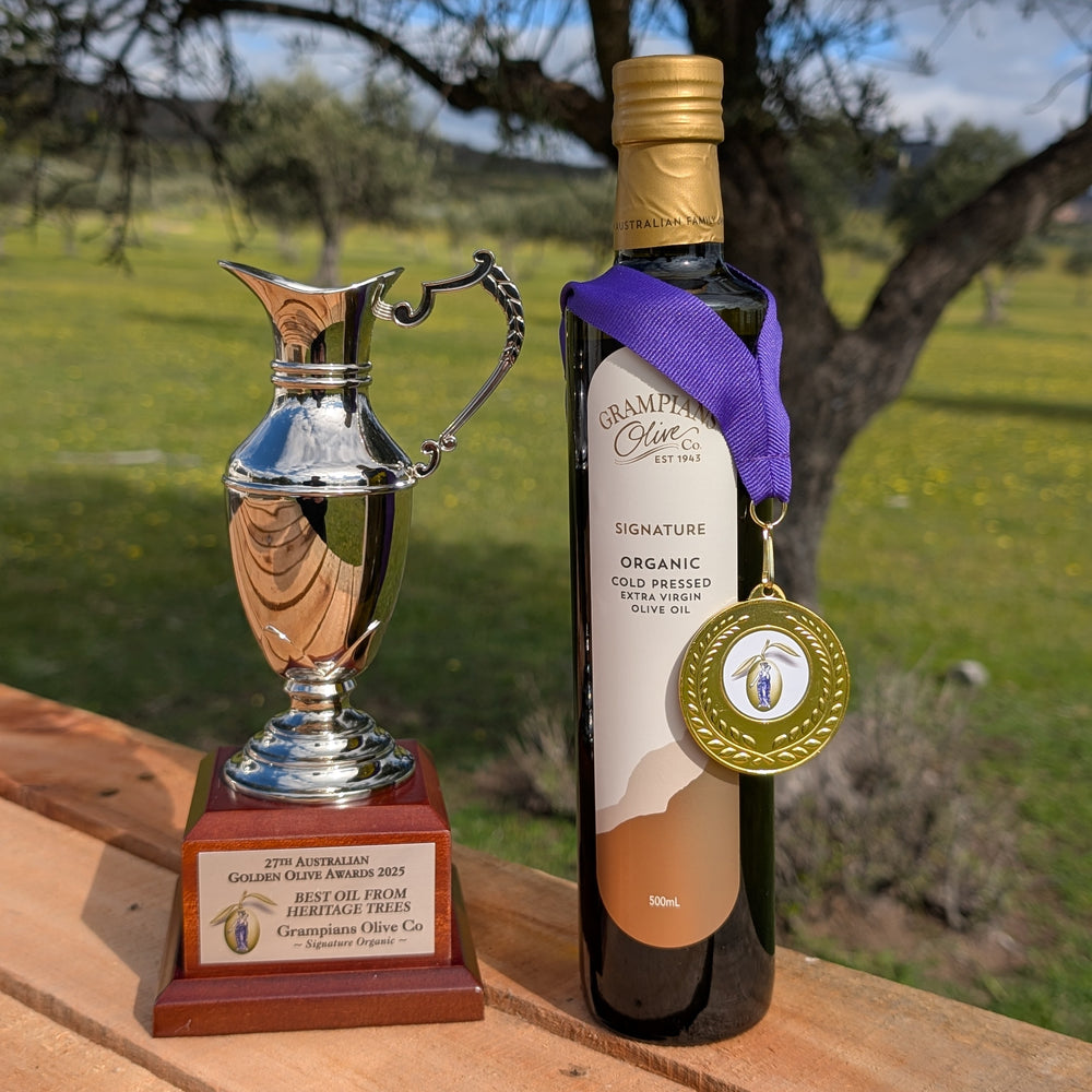 Bottle of Grampians Olive Co Signature Organic Early Harvest Cold Pressed Extra Virgin Olive Oil with gold medal and trophy