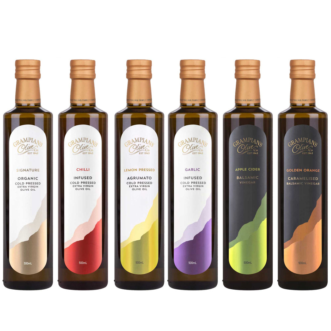 Set of six 500ml bottles of Grampians Olive Co olive oils and balsamic vinegars - different flavours on a white backgroundo 