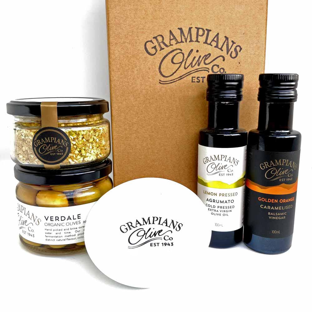 Grampians Olive Co gift set / hamper products including jars of olives, dukkah, bottles, of olive oil, vinegar and a dippping dish with box in background.