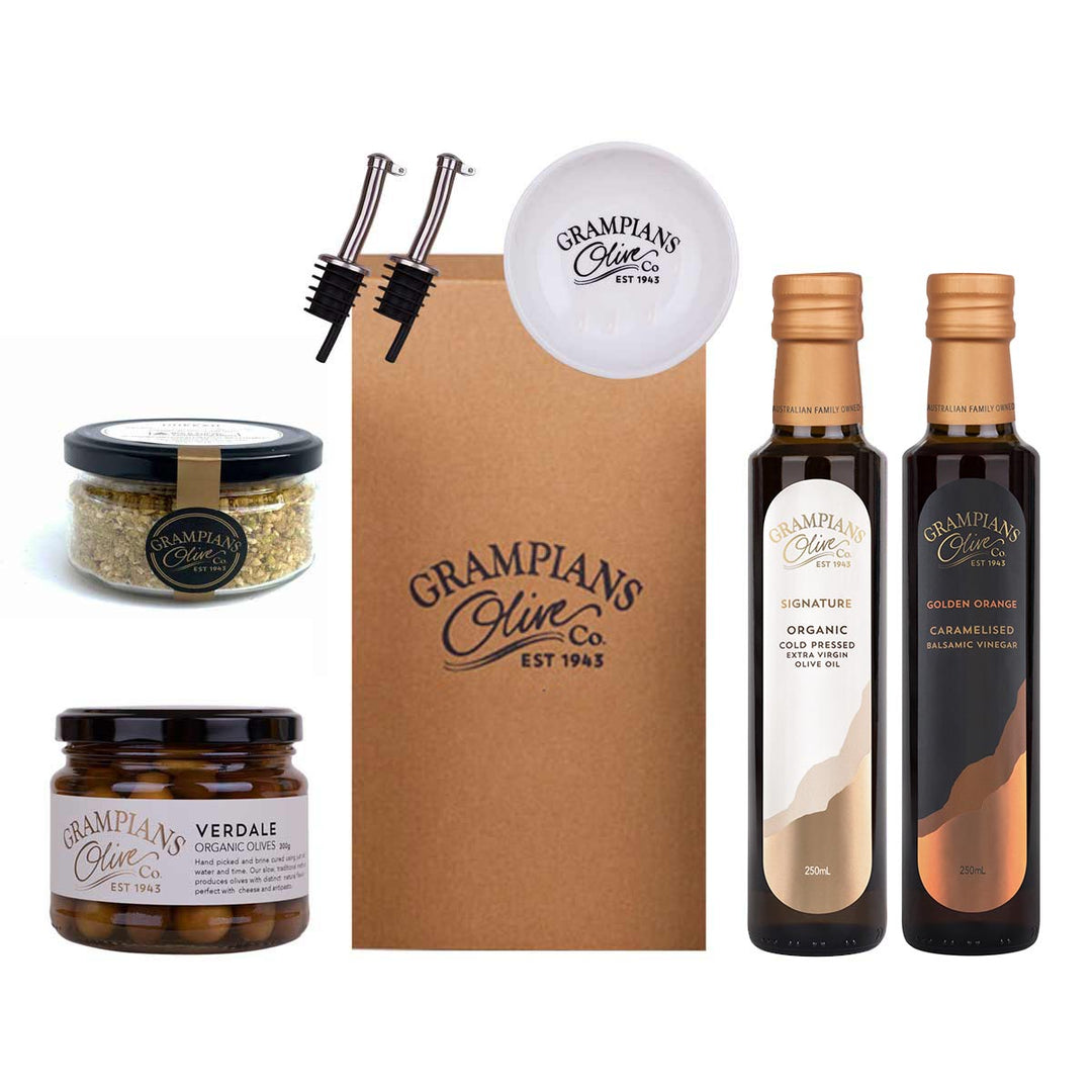 Pantry hamper including organic olive oil, vinegar, olives, dukkah, pourers and dipping dish.