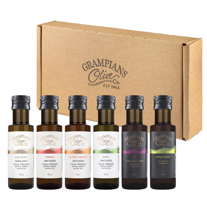 Gift set of miniature olive oil and vinegar bottles from Grampians Olive Co with a cardboard box on a white background