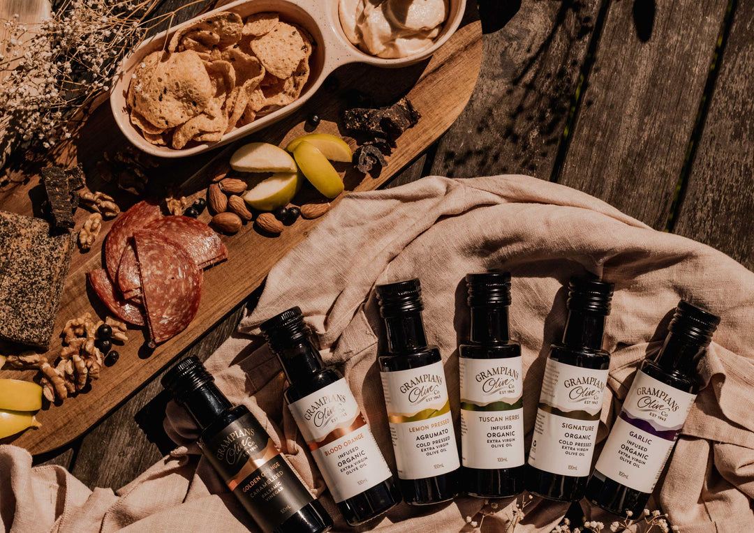 Set of miniature olive oil bottles from Grampians Olive Co with a platter 