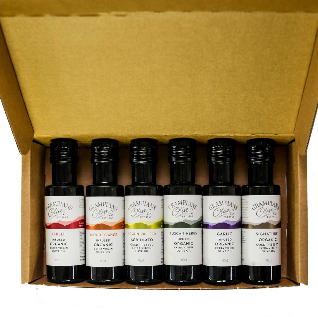 Box of six bottles of different flavoors of olive oil from Grampians Olive Co.
