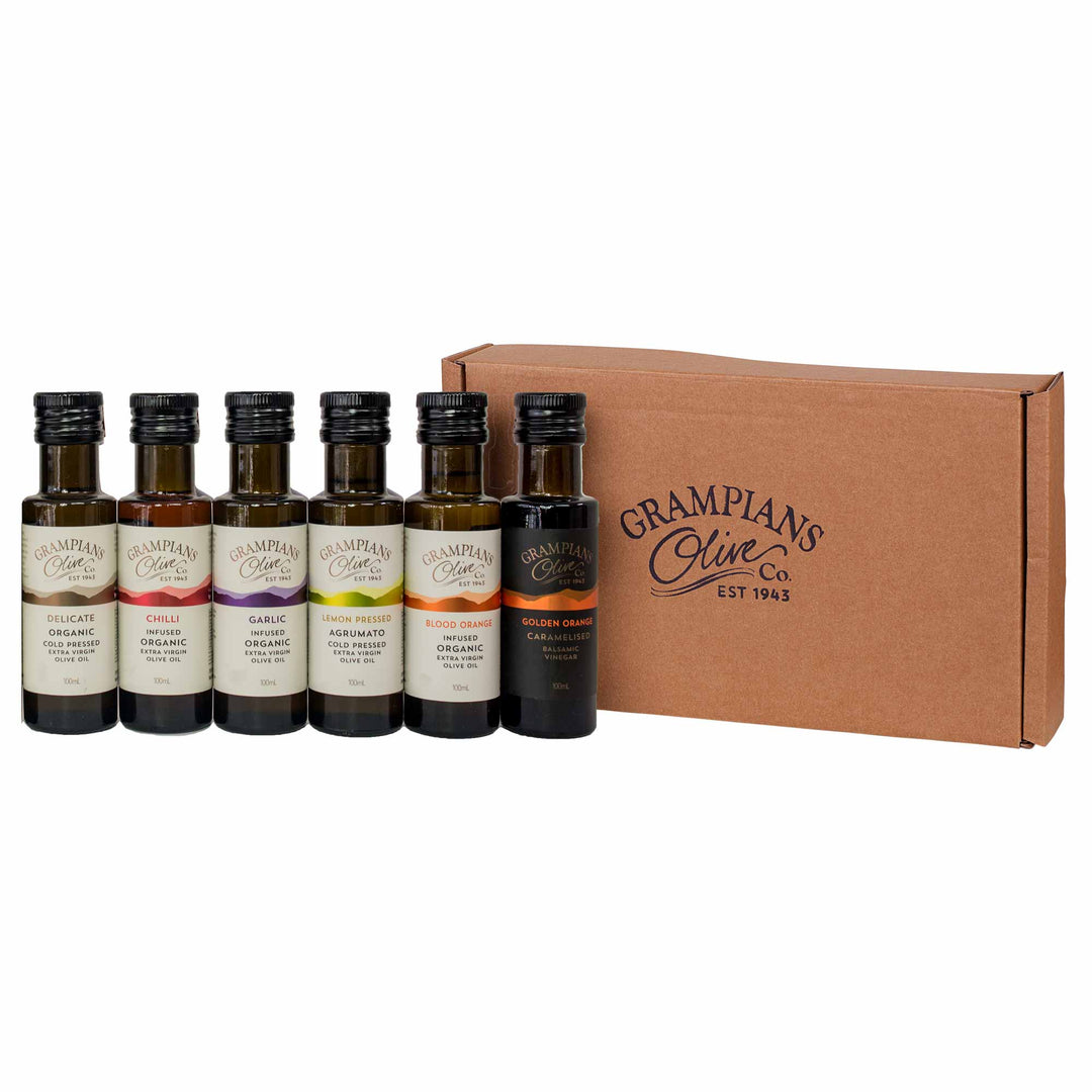 Gift set of miniature olive oil and vinegar bottles from Grampians Olive Co with a cardboard box on a white background
