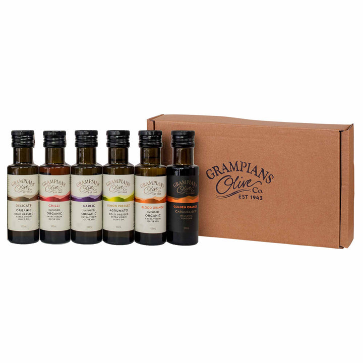 Gift set of miniature olive oil and vinegar bottles from Grampians Olive Co with a cardboard box on a white background